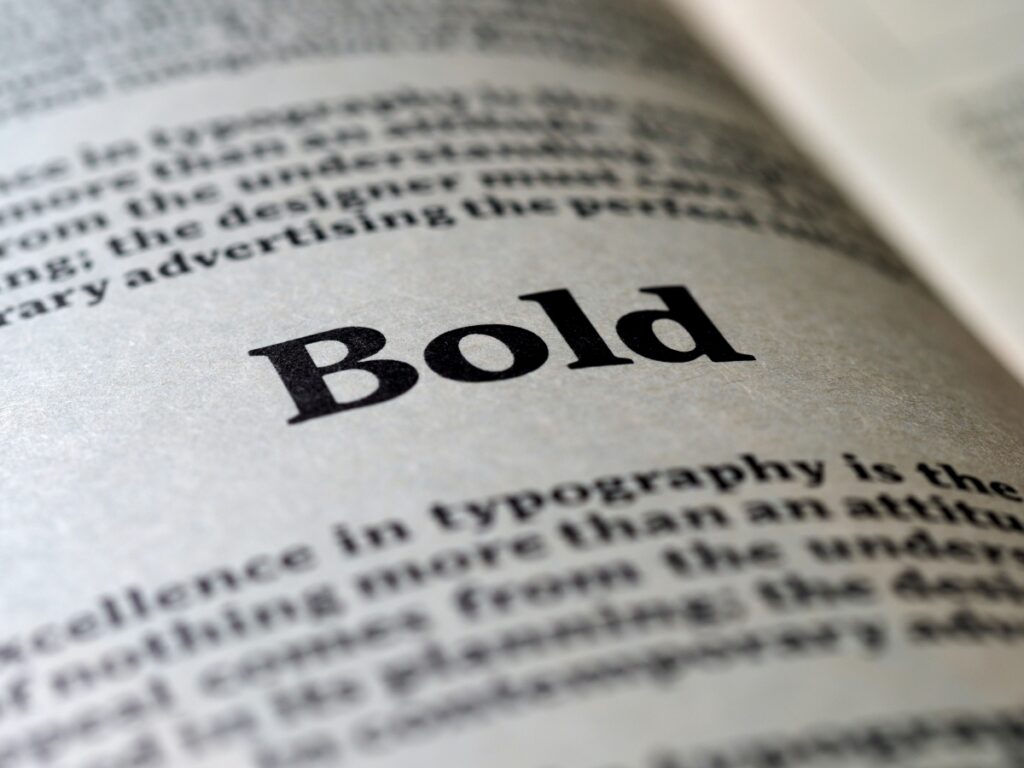 A close up of the word bold in a book, showcasing font pairings.